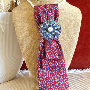 Red Floral Tie Necklace with Blue Brooch
